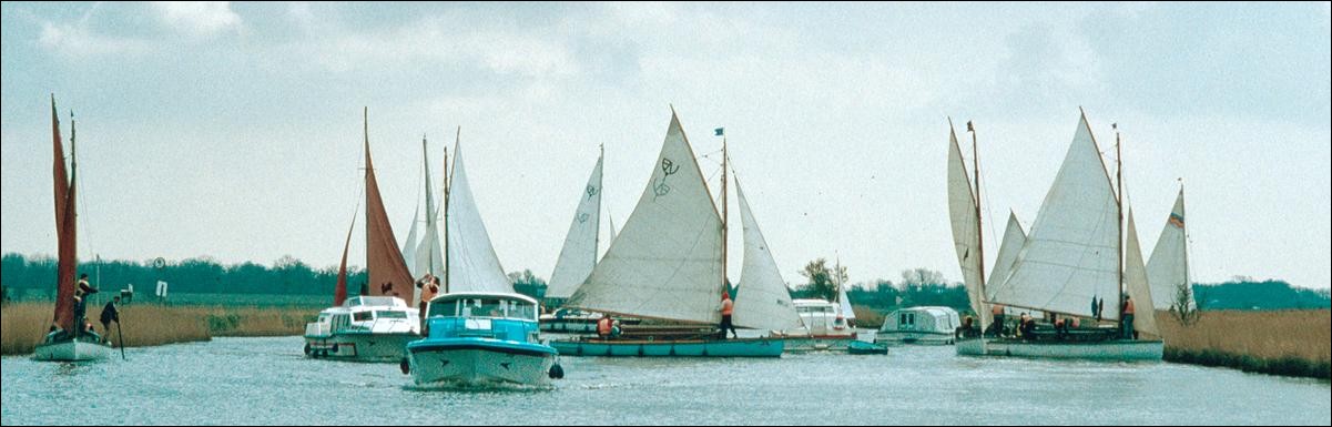 River Bure crowded with sailing boats, Norfolk Broads, England